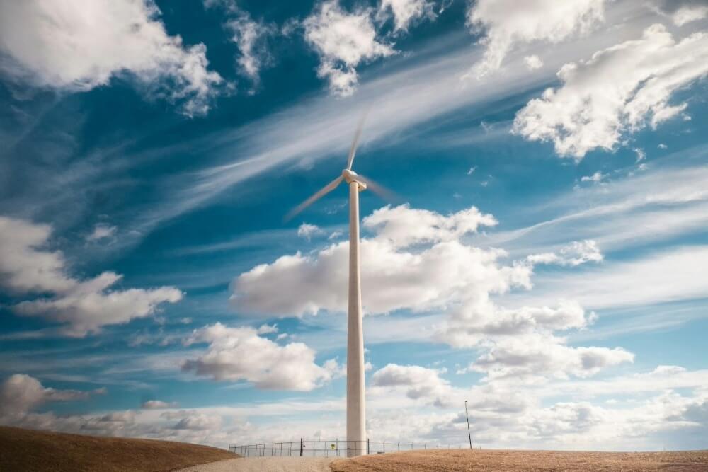 WindPower-1000w A wind turbine with clouds